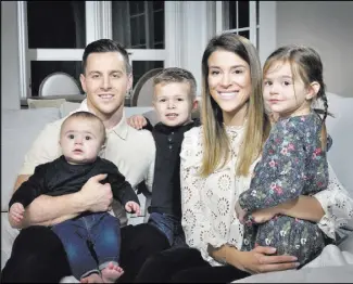  ??  ?? Jonathan and Alexandra Marchessau­lt with their children, from left, William, James and Victoria, at their Summerlin home.