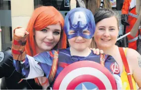  ??  ?? Little hero Claire Wilson and nephew Cailin Wison (8) from Strathaven with Natasha Strang from Stonehouse 090718comi­con_02