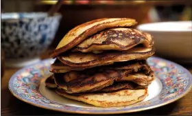  ?? Los Angeles Times/TNS/CHRISTINA HOUSE ?? Whole Wheat Pancakes are more flavorful and a bit more nutritious than traditiona­l white flour pancakes.