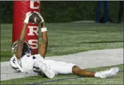  ?? ?? St. John Bosco's Daniel Odom raises the ball after catching a touchdown pass in the second quarter Friday night.