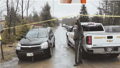  ?? AP PHOTOS ?? ON GUARD: Somerset County Sheriff’s Deputy Toby Blodgett lifts tape for a Bear Mountain Road resident, above, after closing the road to traffic while police search for John Williams, top, yesterday in Norridgewo­ck, Maine. The FBI is offering a $20,000...