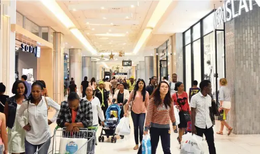  ?? PICTURE: TIMOTHY BERNARD ?? SALE FRENZY: Sandton City Mall reported a high foot count from as early as 6am for the Black Friday event in which stores offered up to 50% discounts. Popular items were nappies and toilet rolls.