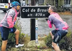  ??  ?? Gary Foreman and Richard Fagg celebrate reaching the top of Col de Brouis in the Alps