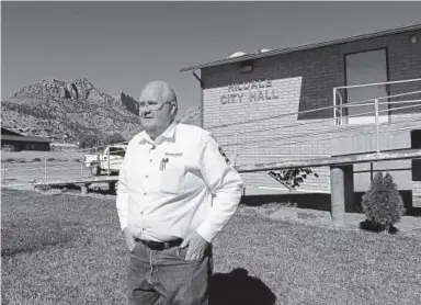  ??  ?? Hildale Mayor Phillip Barlow, a member of the Fundamenta­list Church of Jesus Christ of Latter-day Saints, said people are coping with change by “doing what they have to do.” He says he’s best suited to lead the town because he has lived in the...