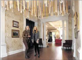  ?? PHOTOS BY STAN CARROLL/THE COMMERCIAL APPEAL ?? DeSoto Arts Council executive director Margaret Yates (left) and Lisa Beene, the arts council board’s treasurer, discuss upcoming events and next year’s schedule in the foyer of the Banks House, home of the council in Hernando, Mississipp­i. Yates, a...