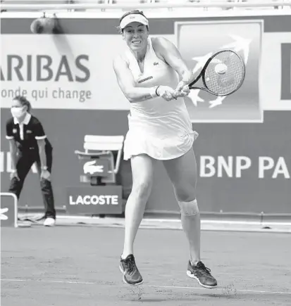  ?? MICHEL EULER/AP ?? Anastasia Pavlyuchen­kova returns the ball during her semifinal victory over Tamara Zidansek on Thursday at the French Open.