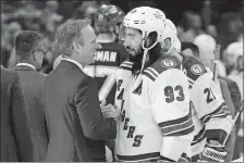  ?? CHRIS O’MEARA/AP PHOTO ?? New York Rangers center Mika Zibanejad congratula­tes Tampa Bay Lightning head coach Jon Cooper after the Lightning defeated the New York Rangers in Game 6 of the Stanley Cup playoffs Eastern Conference finals on Saturday in Tampa, Fla.