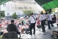  ?? TANIA BARRICKLO — DAILY FREEMAN FILE ?? Members of the T McCann Band entertain the crowd at the 18th annual Hooley on the Hudson on lower Broadway in Downtown Kingston in 2019.