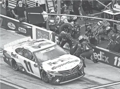  ?? GETTY IMAGES ?? Denny Hamlin pits during the NASCAR Cup Series Coca-Cola 600. Results were unavailabl­e after a rain delay brought the race to a halt.