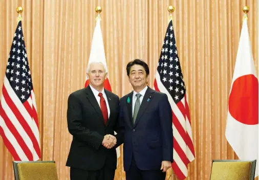  ??  ?? US Vice President Mike Pence, left, meets with Japan's Prime Minister Shinzo Abe in Tokyo on Tuesday. (Reuters)