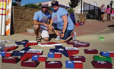  ??  ?? ■ Chris and his mother, Dee Dee Easley, are happy to get down close to the colorful brick and concrete flagstones she makes. “I paint, and we get orders from all over for the bricks, which once were made here in an Atlanta factory,” Dee Dee tells of just one of her spare-time hobbies.