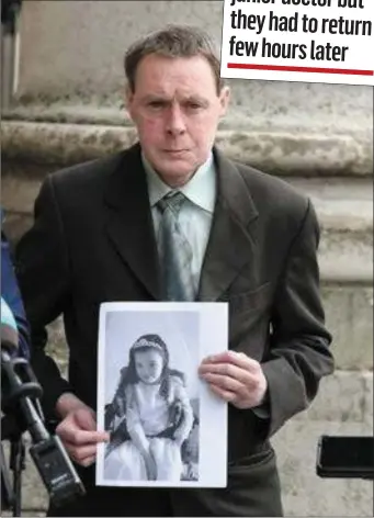  ??  ?? Declan Kilgallon holding a picture of his daughter, Robyn outside the Fourt Courts in Dublin after the action against the HSE was settled.