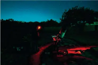  ?? Sam Owens / Staff photograph­er ?? Amateur astrophoto­grapher Chris Hill stands near his telescope and camera at his home in Dripping Springs this month. The town is one of just 34 officially designated Dark Sky Communitie­s in the world.