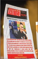  ?? ?? A sign displays a photo of Lt. Jason Elfburg, a Clark County School District police officer, during the protest last February at CCSD headquarte­rs.