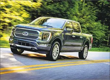  ?? Photog r aphs by Ford Motor Co. ?? FORD is offering the option of a full hybrid engine in its F- 150, the f irst for a full- size pickup truck. The new PowerBoost gasoline- and- electric engine produces a staggering 430 horsepower and 570 pound- feet of torque.