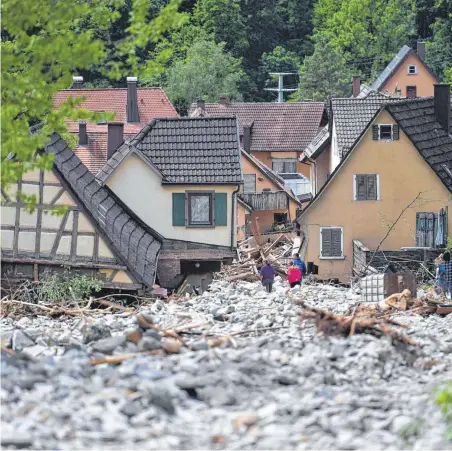 ?? FOTO: MURAT/DPA ?? Am Abend des 29. Mai 2016 zerstörte eine gigantisch­e Lawine mit Geröll den Ort Braunsbach.