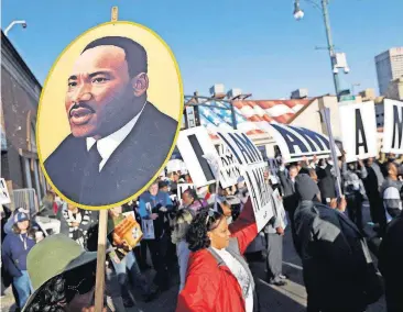  ?? [MARK HUMPHREY/THE ASSOCIATED PRESS] ?? People gather for events commemorat­ing the 50th anniversar­y of the assassinat­ion of the Rev. Martin Luther King Jr. on Wednesday in Memphis, Tenn. King was assassinat­ed April 4, 1968, while in Memphis supporting striking sanitation workers.