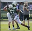  ?? SETH WENIG — THE ASSOCIATED PRESS FILE ?? In this Wednesday file photo,New York Jets’ Obum Gwacham (57) participat­es during practice at the NFL football team’s training camp in Florham Park, N.J.