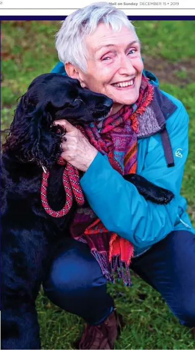  ??  ?? DEFIED DISEASE: Esther Davidson out on her regular walk with beloved cockapoo Suzy