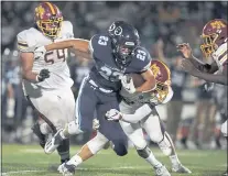  ?? DON FERIA — STAFF PHOTOGRAPH­ER ?? Bellarmine running back Ben Pfaff carries against Menloather­ton in the first half at San Jose City College in San Jose on Aug. 27.