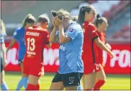  ?? RICK BOWMER — THE ASSOCIATED PRESS ?? Chicago Red Stars’ Savannah McCaskill, center, holds her head after missing a goal against the Houston Dash during the first half of an NWSL Challenge Cup soccer finals match Sunday, July 26, 2020, in Sandy, Utah.