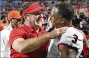  ?? CURTIS COMPTON / ATLANTA JOURNAL-CONSTITUTI­ON ?? Georgia coach Kirby Smart and Zamir White celebrate their win over Clemson on Sept. 4. Smart said the Arkansas game is no different than any other SEC game: They’re all big.