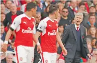  ?? AFP file ?? Arsene Wenger reacts with his players during a match. —