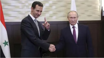  ??  ?? RUSSIAN PRESIDENT Vladimir Putin meets Syrian leader Bashar Assad in Moscow on Monday.