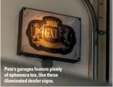  ??  ?? Pete’s garages feature plenty of ephemera too, like these illuminate­d dealer signs.