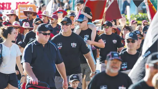  ?? Pictures: ANNA ROGERS ?? MOVING MESSAGE: More than 400 took to the streets of Cairns at the weekend to draw attention to the effects of proposed penalty rate changes.