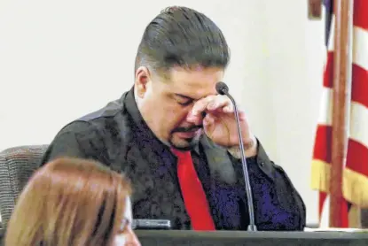  ?? Photos by Bob Owen / Staff photograph­er ?? Gabriel Martinez, 37, who’s being tried on charges of killing his common-law wife, Lori Lee Ortiz, 35, wipes away tears while on the stand in 379th District Court in the Cadena-Reeves Justice Center.