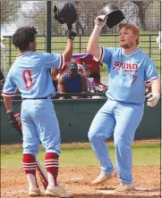  ?? Photo by David Seeley/Sequoyah County Times ?? Spiro’s Tyson Covey, right, is congratula­ted at home plate by teammate Connor Reed after hitting a solo home run in the fifth inning of Saturday afternoon’s road game against Sallisaw Central.
