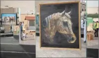  ?? ?? Horse paintings on display at Katara as part of the Katara Internatio­nal Arabian Horse Festival (KIAHF-2023).