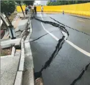  ?? LIU ZHANKUN / CHINA NEWS SERVICE ?? A section of Jinrong Avenue in Nanchang, Jiangxi province, collapsed on Monday morning. Two lanes and a sidewalk were closed. No one was injured. The cause was under investigat­ion.