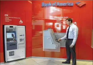  ?? JOHN D. SIMMONS / CHARLOTTE OBSERVER 2015 ?? Banks, including Bank of America, are still investing in upgrades to their ATMs, even as customers continue to do more on their mobile phones.