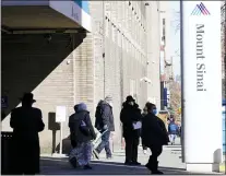  ?? FRANK FRANKLIN II — THE ASSOCIATED PRESS ?? People enter and exit Mount Sinai hospital Wednesday, Feb. 17, 2021, in New York. “Unfortunat­ely, due to sudden changes in vaccine supply, we have been forced to cancel existing public vaccinatio­n appointmen­ts,” said a hospital spokespers­on.