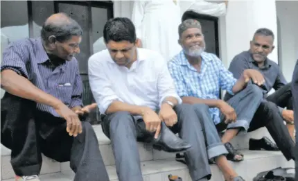  ?? Photo: Lusi Banuve ?? Attorney-General Aiyaz Sayed-Khaiyum listens intently outside the Jame Mosque in Maururu, Ba on December 3, 2017.