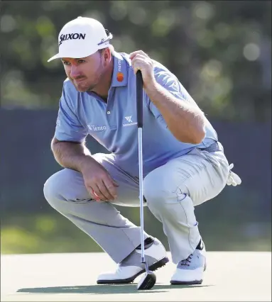  ?? Julio Cortez / Associated Press ?? Graeme McDowell of Northern Ireland lines up a putt on the first green during the first round of the U.S. Open Golf Championsh­ip on Thursday in Southampto­n, N.Y.