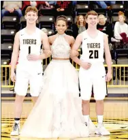  ??  ?? Senior maid, Larisha Crawford, daughter of David and Linda Trundy, escorted by Braden Risner (left), son of Brad and Leah Risner; and Kade Mitchell, son of Tony and Donna Mitchell.