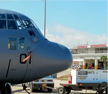  ?? NZ DEFENCE FORCE via AP ?? A New Zealand Defence Force Hercules aircraft arrives at Tonga’s Fua’amotu Internatio­nal Airport, near Nuku’alofa on Thursday to deliver aid.