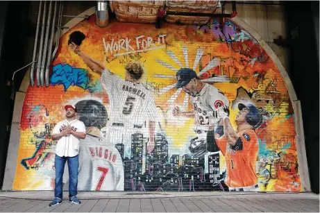  ?? Karen Warren / Houston Chronicl ?? Astros greats past and present are featured in a mural by local graffiti artist Franky Cardona in Minute Maid Park’s Home Run Alley.