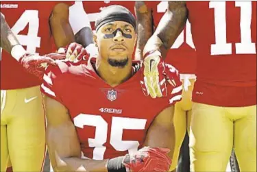  ??  ?? Free agent safety Eric Reid, who knelt for anthem last season with 49ers, is asked about issue by Bengals owner.