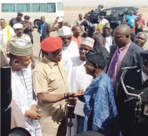  ??  ?? Lalong and Dalung exchange pleasantri­es shortly before President Buhari’s plane landed at the Yakubu Gawon airport.