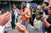  ?? PICTURES: MICHAEL WALKER ?? Sapho Mahilihili, and other black consciousn­ess protesters in front of the public protector’s office in Cape Town yesterday.
