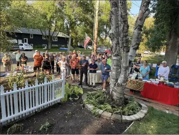  ?? COURTESY OF BOB THACKER ?? Community members gather outside the home they rebuilt in Northfield, Minnesota, for a deserving family. “Over 150 people came to the fiesta, which was to thank all those who made it possible,” said Bob Thacker, who, with his wife, coordinate­d the project.