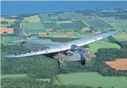  ?? PHOTO PROVIDED BY EXPERIMENT­AL AIRCRAFT ?? The Experiment­al Aircraft Associatio­n's Ford Tri-Motor flies near Lake Winnebago in Oshkosh, Wisconsin.