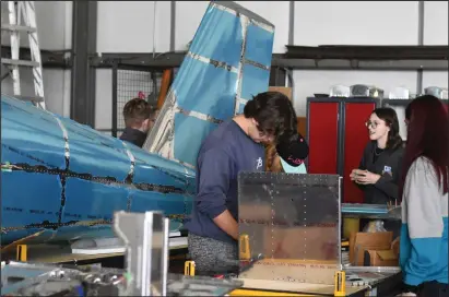  ?? NEWS PHOTO KENDALL KING ?? Students at the Dave Rozdeba South Alberta Flight Academy work on a plane they have been constructi­ng since 2020, which they hope to get off the ground this summer.