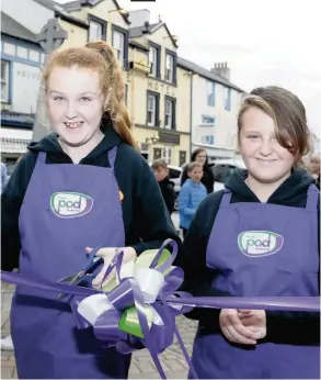  ??  ?? Yazmin and Emily cutting the ribbon to open Holyhead’s Pod