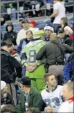  ?? By Ted S. Warren, AP ?? Walk this way: An unruly fan is arrested at a 2009 Seahawks game.