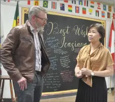  ?? ?? Swift Current MLA Everett Hindley speaks with Icasiana de Gala during the come-and-go farewell at the Southwest Newcomer Welcome Centre, April 13.